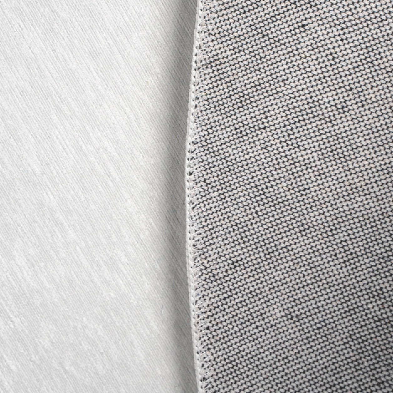 a close up of a tie on a white surface