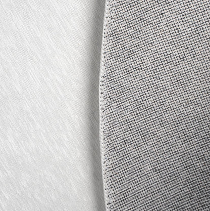 a close up of a tie on a white surface