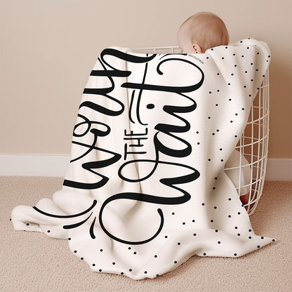 a baby wrapped in a blanket with the words stay the night printed on it